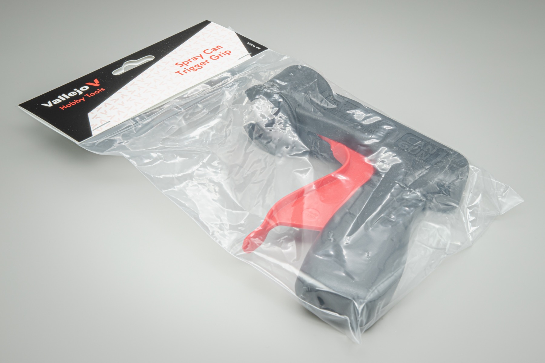 Universal spray can trigger grip